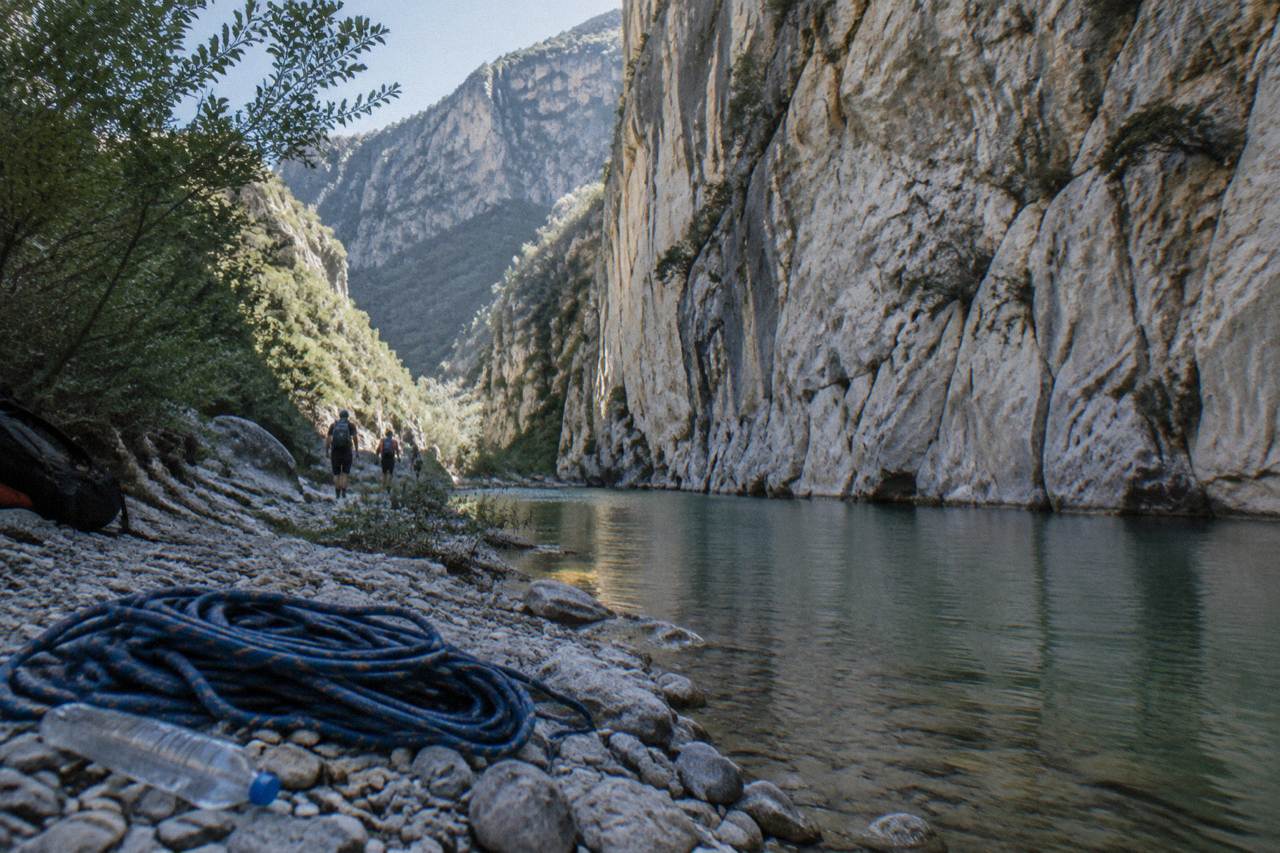 Canyon walls rising above green water in the Sierra de Santiago near Monterrey